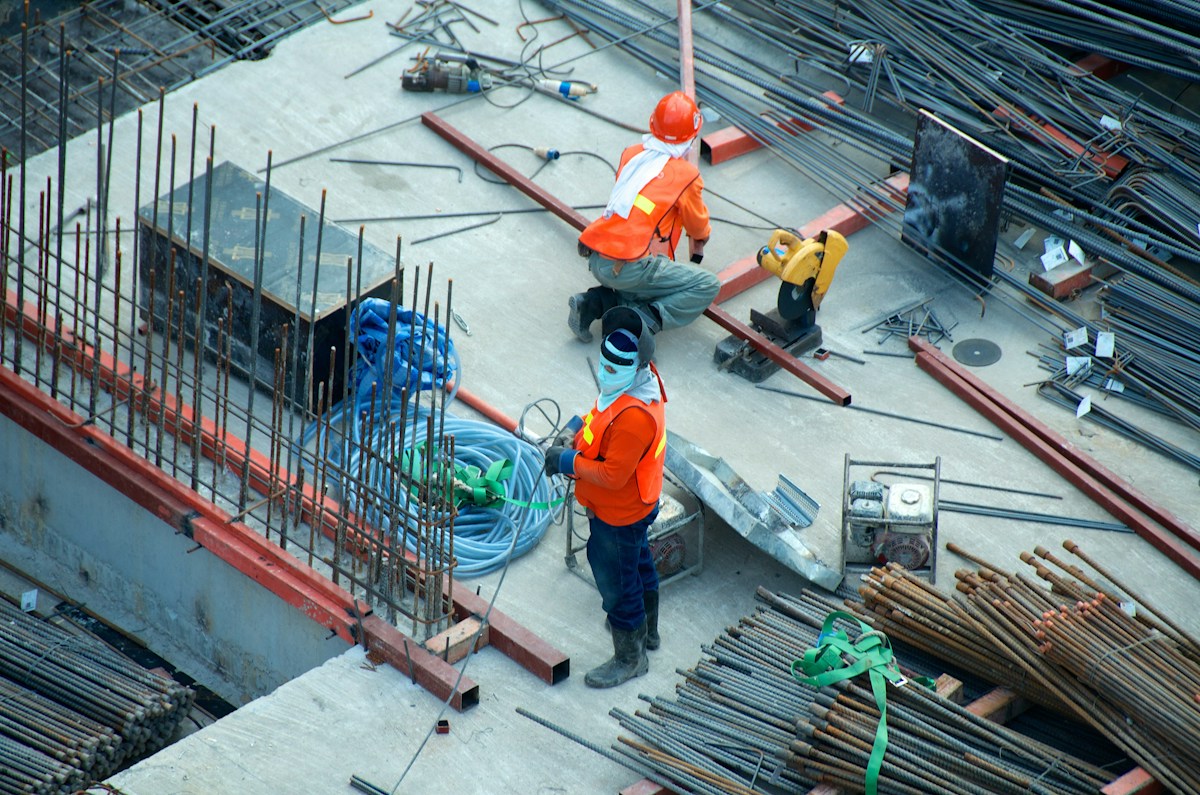 Engineering and construction teams working on a building structure